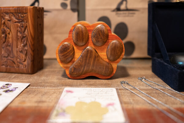 Handmade black walnut and beechwood paw print urn